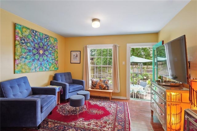 sitting room featuring wood finished floors