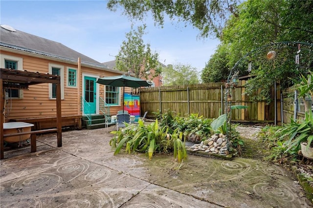 view of patio / terrace with fence and entry steps