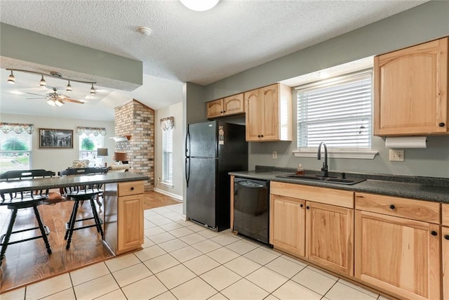 4740 W Esplanade Ave, Metairie, LA 70006 - kitchen featuring light brown cabinetry, a sink, dark countertops, ceiling fan, and black appliances