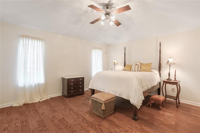 4740 W Esplanade Ave, Metairie, LA 70006 - bedroom with wood finished floors, baseboards, and ceiling fan