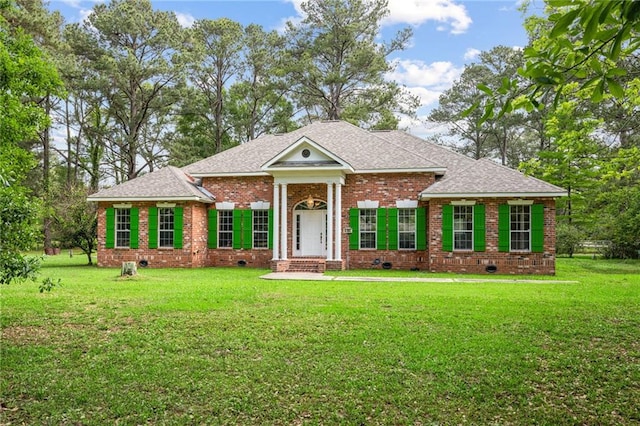 4761 Sharp Rd, Mandeville, LA 70471 - greek revival inspired property with crawl space, brick siding, roof with shingles, and a front lawn