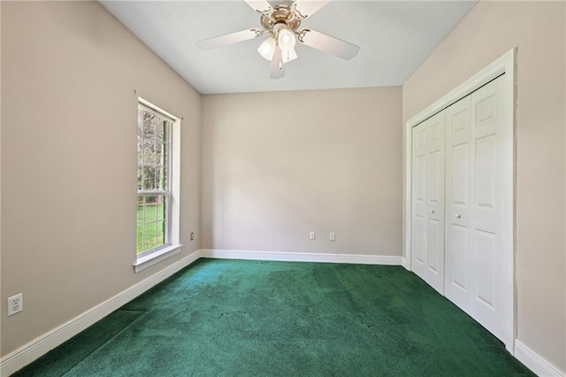 4761 Sharp Rd, Mandeville, LA 70471 - unfurnished bedroom with dark carpet, a closet, and ceiling fan