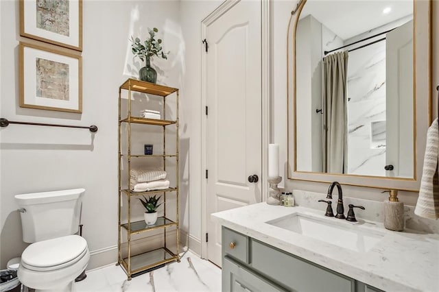 bathroom featuring a shower with curtain, toilet, baseboards, marble finish floor, and vanity