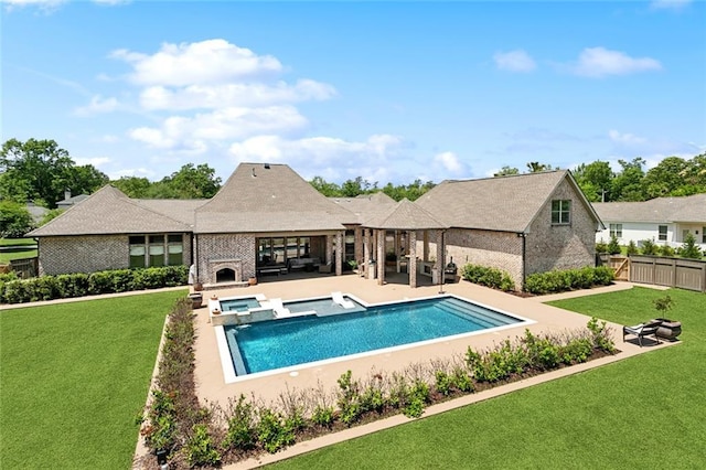 view of pool featuring a gazebo, a lawn, fence, a patio, and a pool with connected hot tub