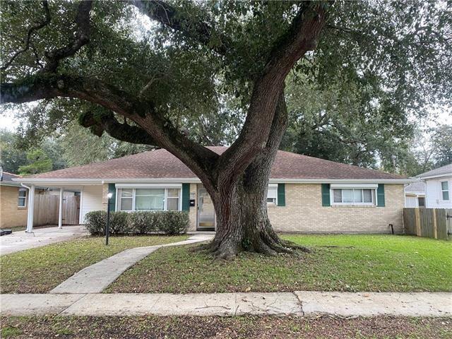 536 Olive Dr, Harvey, LA 70058 - ranch-style home featuring a carport, brick siding, and driveway