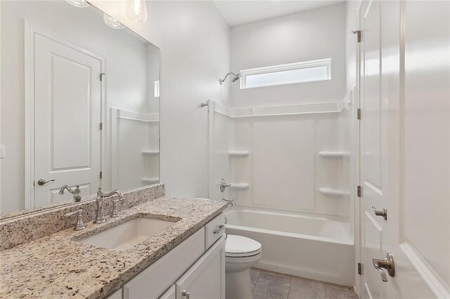 bathroom with shower / tub combination, vanity, toilet, and tile patterned floors