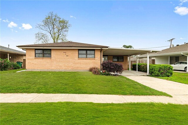 1508 Eisenhower Ave, Metairie, LA 70003 - view of front of house with brick siding and a front lawn