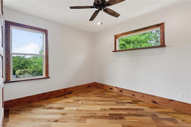 unfurnished room featuring ceiling fan, baseboards, light wood-style floors, and recessed lighting