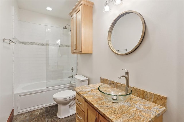 full bath featuring toilet, vanity, and bathtub / shower combination