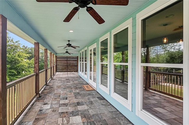 exterior space with a ceiling fan and french doors