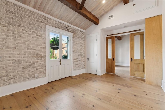 foyer entrance featuring wooden ceiling, vaulted ceiling with beams, brick wall, light wood-type flooring, and visible vents