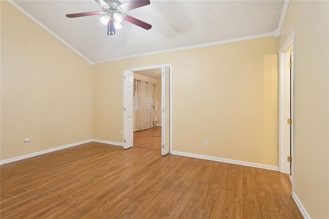 unfurnished room with crown molding, ceiling fan, light wood finished floors, and baseboards