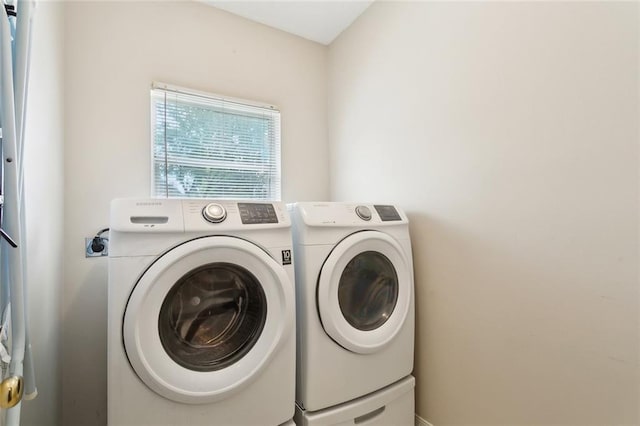 laundry area featuring independent washer and dryer and laundry area
