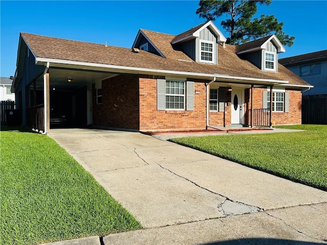 2121 Mediamolle Dr, New Orleans, LA 70114 - view of front of property with driveway, brick siding, an attached carport, covered porch, and a shingled roof
