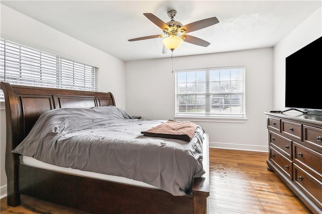 2121 Mediamolle Dr, New Orleans, LA 70114 - bedroom with baseboards, light wood-style flooring, and ceiling fan