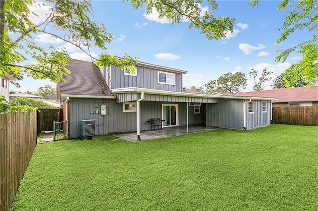 2121 Mediamolle Dr, New Orleans, LA 70114 - back of house featuring a patio area, central AC, and board and batten siding