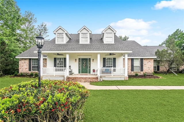 1229 Hampton Ct, Slidell, LA 70460 - cape cod house with a porch, a ceiling fan, and a front yard