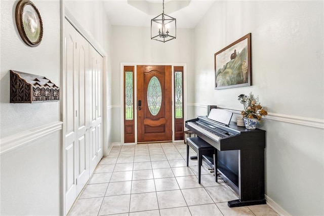 1229 Hampton Ct, Slidell, LA 70460 - entryway featuring a chandelier, baseboards, and light tile patterned floors