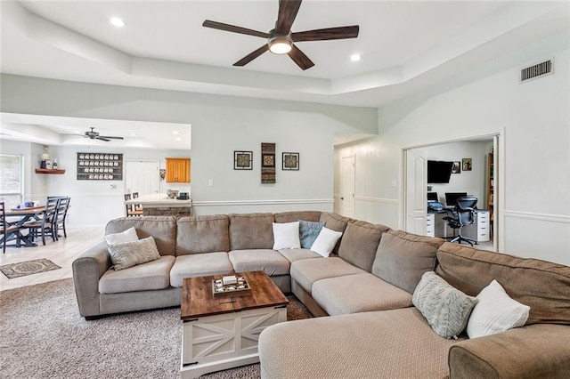 1229 Hampton Ct, Slidell, LA 70460 - living area featuring a tray ceiling, visible vents, recessed lighting, tile patterned flooring, and ceiling fan