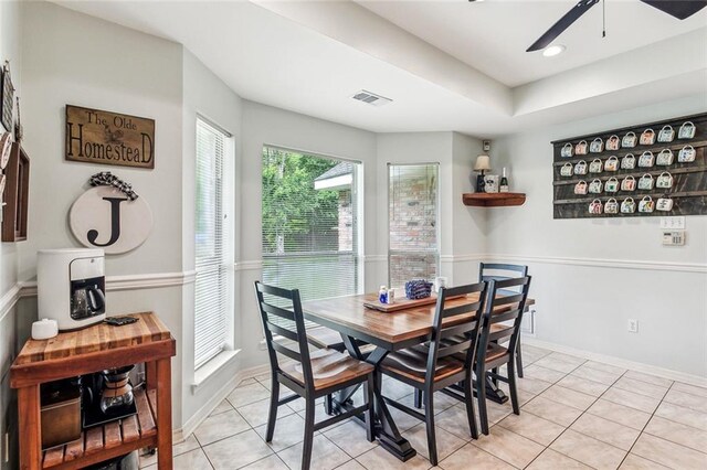 1229 Hampton Ct, Slidell, LA 70460 - dining space featuring light tile patterned floors, baseboards, ceiling fan, and visible vents