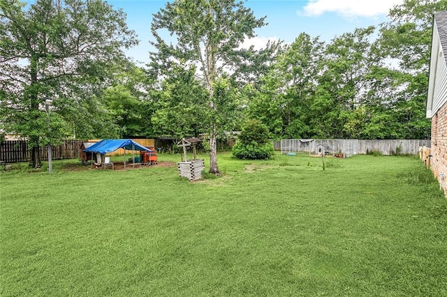 1229 Hampton Ct, Slidell, LA 70460 - view of yard featuring an outbuilding and a fenced backyard