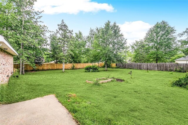 1229 Hampton Ct, Slidell, LA 70460 - view of yard with a fenced backyard