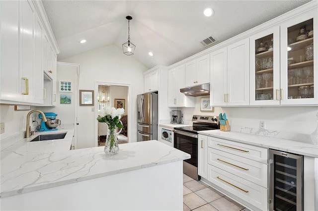 kitchen with a sink, beverage cooler, stainless steel appliances, under cabinet range hood, and visible vents