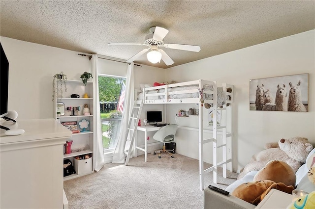 carpeted bedroom with a textured ceiling, a ceiling fan, and access to outside