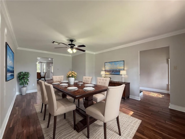 4612 Lorino St, Metairie, LA 70006 - dining room with dark wood-type flooring, baseboards, ornamental molding, and ceiling fan