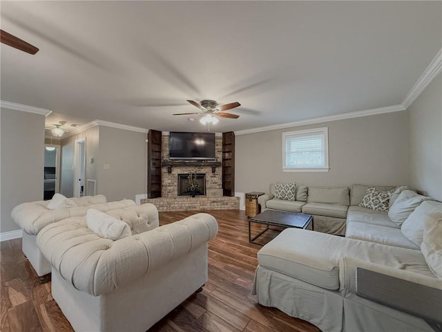 4612 Lorino St, Metairie, LA 70006 - living area with ceiling fan, a brick fireplace, ornamental molding, dark wood-style flooring, and baseboards