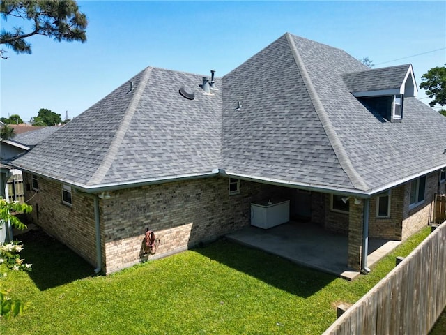 4612 Lorino St, Metairie, LA 70006 - view of side of property featuring a shingled roof, a patio, and brick siding