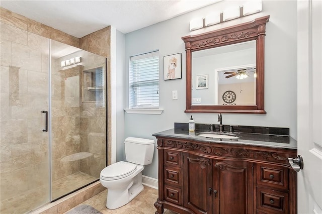 3754 Ashton Dr, Destrehan, LA 70047 - bathroom featuring a stall shower, toilet, baseboards, a ceiling fan, and vanity