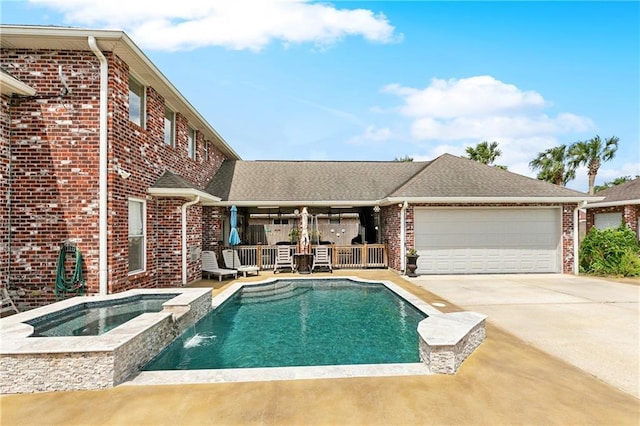 view of pool featuring a pool with connected hot tub