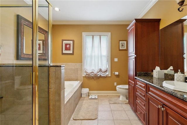 full bathroom with tile patterned flooring, a shower stall, toilet, vanity, and a garden tub