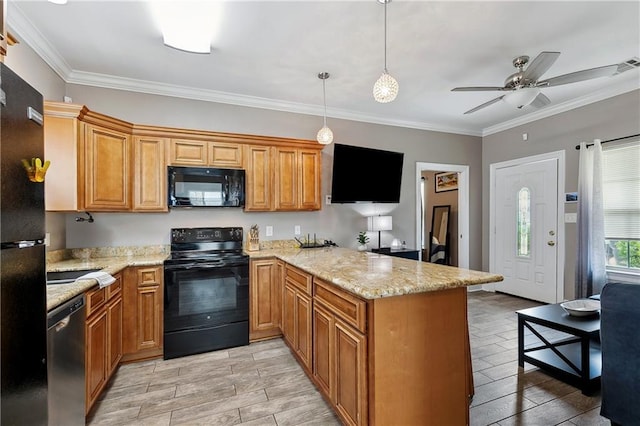 kitchen featuring black appliances, wood tiled floor, a peninsula, and ornamental molding
