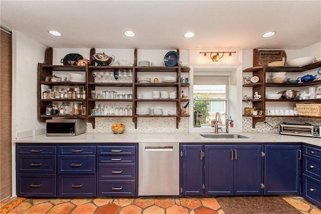 bar with tasteful backsplash, a sink, stainless steel appliances, a toaster, and recessed lighting