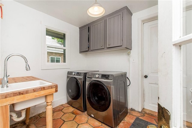 laundry room featuring washer and dryer and cabinet space
