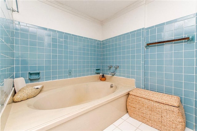 bathroom with a bath, ornamental molding, tile patterned flooring, and tile walls