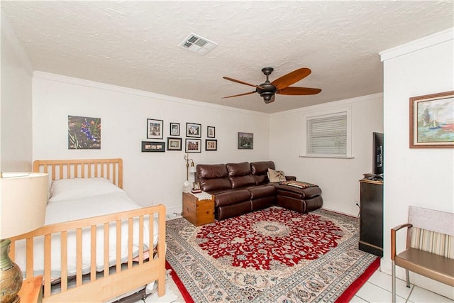 interior space featuring crown molding, a textured ceiling, visible vents, and ceiling fan