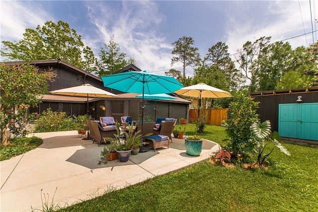 view of patio / terrace with outdoor lounge area and fence