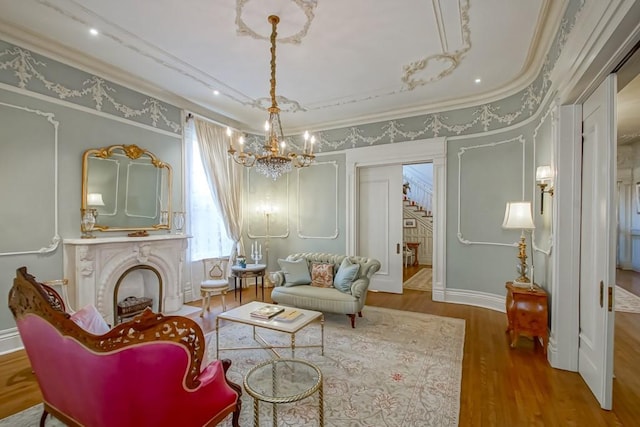 1711 Palmer Ave, New Orleans, LA 70118 - living area featuring a chandelier, wood finished floors, stairs, crown molding, and a fireplace