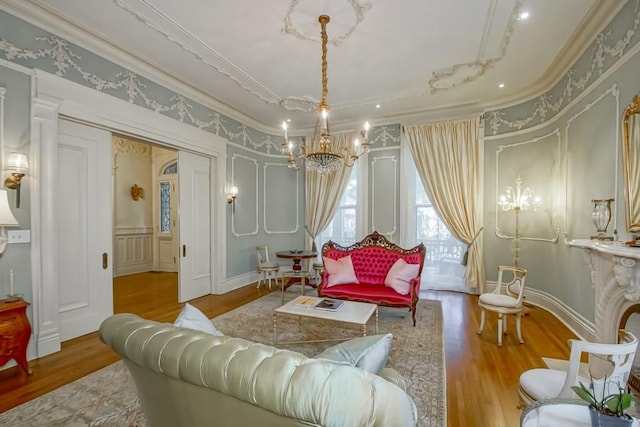 1711 Palmer Ave, New Orleans, LA 70118 - sitting room featuring ornamental molding, a chandelier, wood finished floors, and a decorative wall