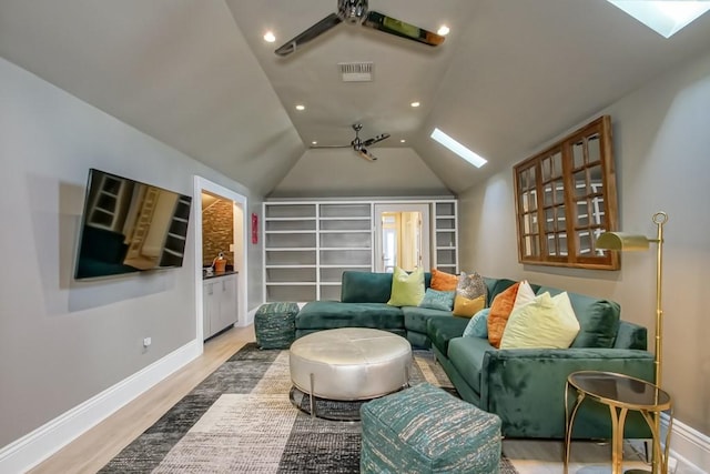 1711 Palmer Ave, New Orleans, LA 70118 - living area featuring baseboards, light wood-style flooring, built in shelves, recessed lighting, and vaulted ceiling