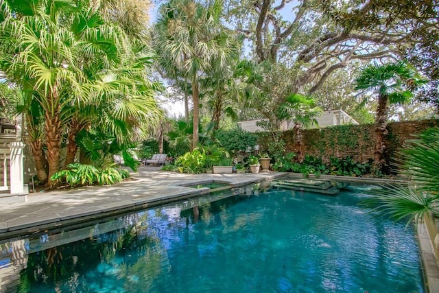 1711 Palmer Ave, New Orleans, LA 70118 - view of swimming pool with fence, a patio area, and a pool with connected hot tub