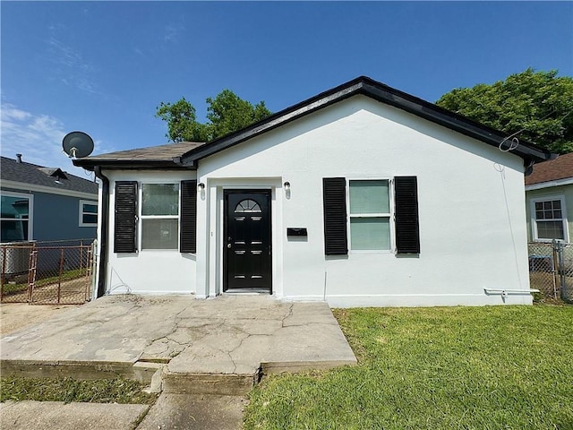 view of front of house featuring stucco siding