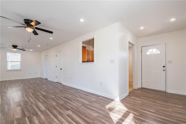 entrance foyer with wood finished floors, a ceiling fan, baseboards, and recessed lighting