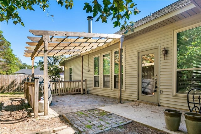 view of patio / terrace featuring a pergola and fence