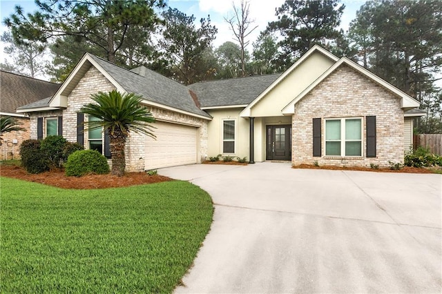 craftsman-style home featuring brick siding, an attached garage, driveway, and a front lawn