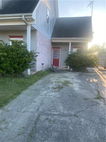103 Warwick St, La Place, LA 70068 - property entrance with brick siding and roof with shingles