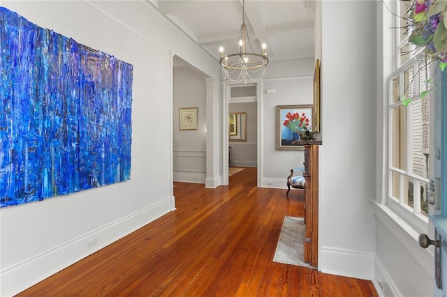 5934 Chestnut St, New Orleans, LA 70118 - hall with hardwood / wood-style flooring, beamed ceiling, coffered ceiling, ornamental molding, and a notable chandelier